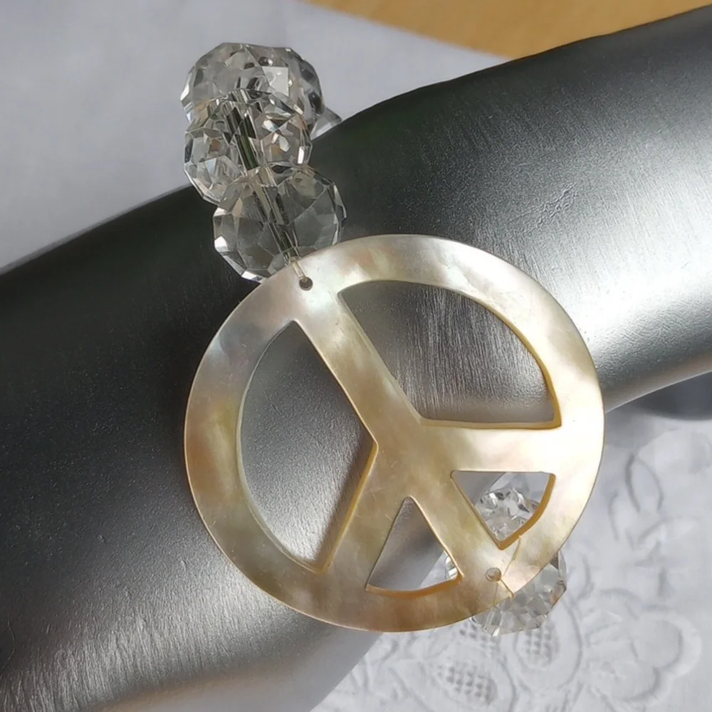 Large faceted Crystal beads w mother of pearl peace sign stretch bracelet